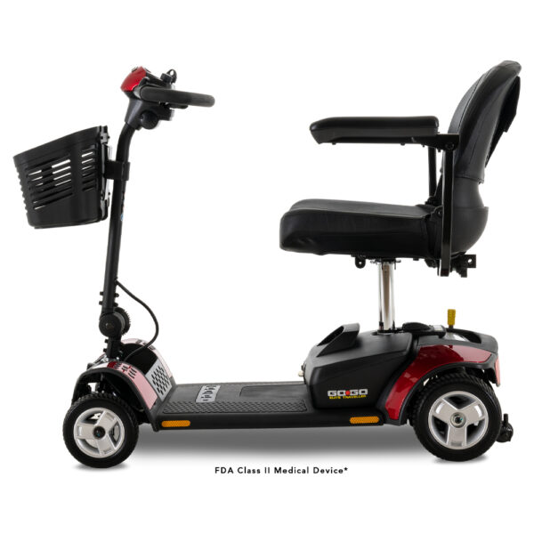 A side view of the Go Go® Elite Traveller 4-wheel mobility scooter, featuring a red and black design with a front basket and a comfortable seat equipped with armrests, powered by a 12 Ah battery.
