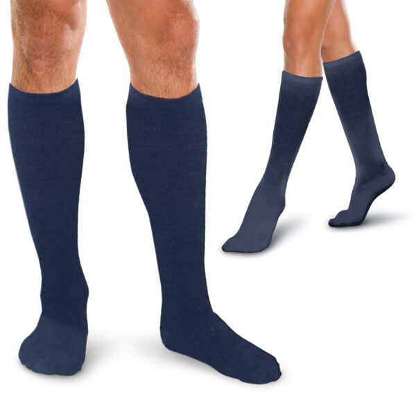 Two pairs of legs wearing Core Spun 15-20 mmHg knee-high socks, one in dark blue and the other in black, displayed on a white background.